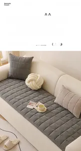 Close-up of thick gray chenille sofa cushion with exquisite square quilting pattern