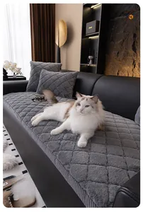 Close-up of grey quilted plush sofa cover with premium thick faux rabbit fur texture