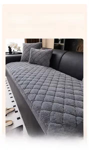 Detail of grey checkerboard rabbit plush sofa cushion with thick quilted texture