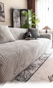 Detail of 3D textured jacquard fleece sofa cover with elegant palm leaf patterns