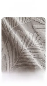 Close-up of soft light grey jacquard velvet sofa cover with detailed leaf pattern