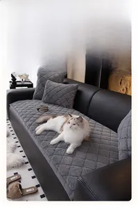 Detail of grey quilted plush sofa cover with anti-scratch fabric and matching pillow