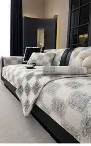 Detailed view of textured faux linen sofa cover with non-slip plaid fabric and embroidery