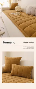 Detail of ginger yellow chenille sofa cushion and pillow with herringbone texture