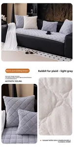 Detail of light grey faux rabbit fur sofa cover featuring quilted plaid texture and non-slip back
