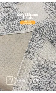 Detail of grey textured fabric sofa cover with non-slip silicone particles on the back
