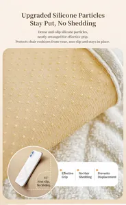 Detailed close-up of non-slip backing with silicone dots on plush white sofa cover