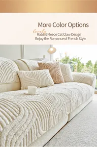 Detail of cream plush velvet sofa cover with textured wave pattern and matching pillows