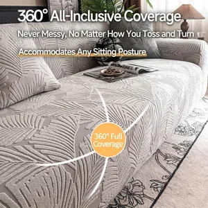 Light gray stretch sofa cover with textured leaf jacquard and matching pillowcase