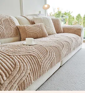 Macro view of thick corrugated plush sofa cushion and matching textured throw pillows