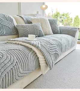 Close-up of thick plush sofa cover with wave texture and nordic gray and white contrast
