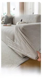 Detail showing high-elasticity knitted fabric with textured mountain pattern on sofa cover