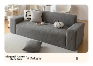 Close-up of dark gray elastic sofa cover featuring textured diagonal leaf vein pattern