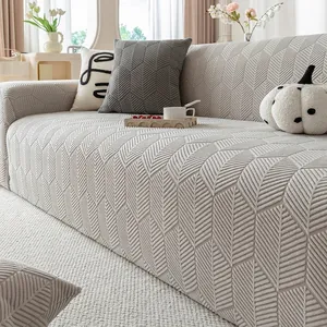 Universal light gray 360-degree stretch sofa cover with textured herringbone fabric pattern