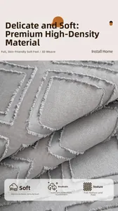 Close-up of high-density gray sofa cover fabric with embossed texture and soft fringe