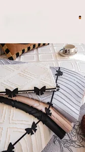 Detail of premium thickened sofa cushions with quilted diamond texture and bow accents