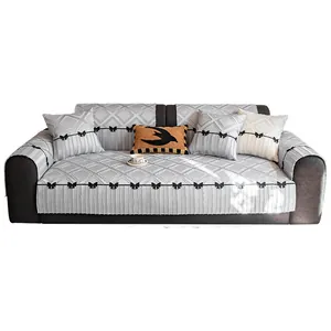 Light gray quilted non-slip sofa cover set with elegant black bow lace and diamond pattern