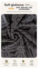 Close-up of gray polar fleece sofa cover fabric with black abstract floral pattern