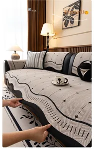 Detail of chenille sofa cushion featuring chic wavy edges and black heart patterns
