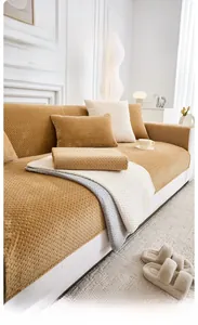Detail view of thick milk velvet sofa cushions and pillows in yellow, white and grey colors