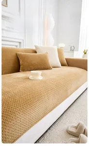 Macro detail of camel milk fleece sofa cover with 3D dot texture for winter comfort
