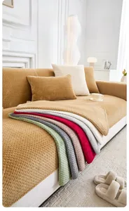 Detailed view of thick milk velvet sofa cover showing corn kernel texture and multiple colors