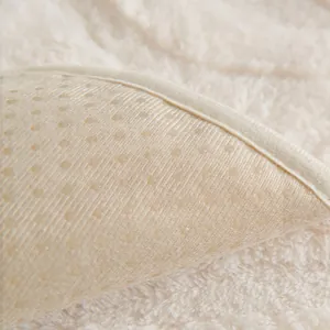 Creamy white plush sofa cover with anti-slip backing and thick faux fur texture
