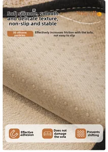 Detailed macro view of non-slip silicone particles on beige chenille sofa protector cover