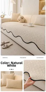 Detail of white chenille sofa cushion with waffle texture and black wave edge trim