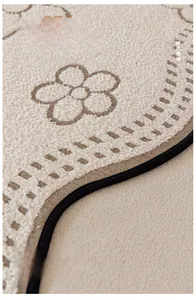 Detailed close-up of high-density plush sofa mat featuring reinforced black stitching edge