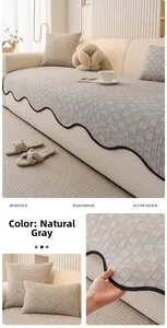 Detailed view of gray chenille sofa cushion with black wavy edges and textured fabric