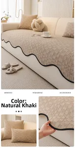 Detail of khaki chenille sofa cushion featuring quilted plaid texture and wavy black trim