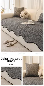 Detailed close-up of thick chenille sofa cushion featuring black scalloped wave edges