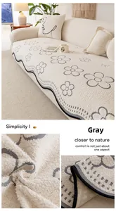 Close-up of grey irregular plush sofa cushion showing wave edges and anti-slip backing