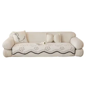 Off-white irregular velvet sofa cover set with floral patterns and bow pillows