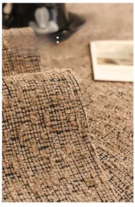 Close-up of heavy chenille fabric showing the thick brown and black textured weave