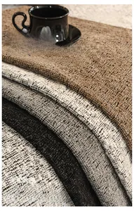 Close-up of thick chenille fabric swatches in neutral tones for sofa protection