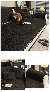 Detail of black heavy-weight chenille sofa cover with stylish pom-pom fringe trim