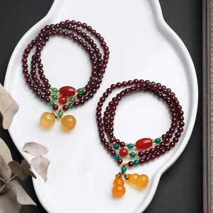 Three-layer garnet bead bracelet with chalcedony double gourd charms in vintage style