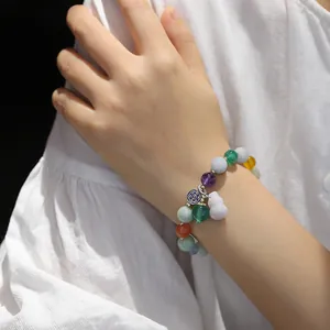 Colorful natural jadeite bead bracelet with enamel charm and purple gourd pendant on wrist