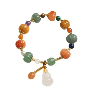Natural pumpkin bead bracelet with white gourd pendant and colorful gemstone charms