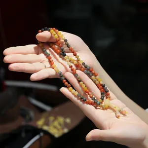 Natural Xinjiang Gold Silk Jade 108 beads bracelet in vintage Chinese style worn on hand
