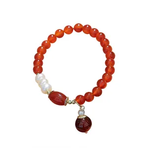 Red agate and freshwater pearl beaded bracelet for women with elegant ball pendant