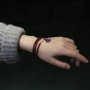 Three-layer garnet bracelet with amethyst shell pendant and pearl accents for women