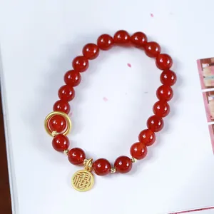Natural 8mm red agate bead bracelet with golden Fu pendant and elegant charms