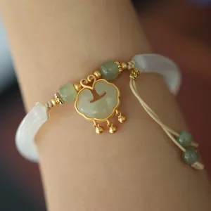 Chinese natural chalcedony ruyi lock bracelet with white jade beads and gold accents