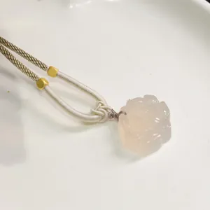 Pale pink chalcedony flower pendant necklace with beige woven cord and gold beads