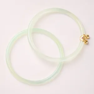 Natural apple green chalcedony bangle set with golden Ruyi cloud charm and bells