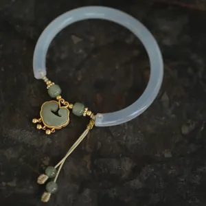 Traditional white chalcedony Ruyi lock bangle with golden accents and green beads