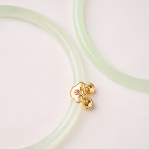 Natural apple green chalcedony bangle with golden ruyi bell charm in classic style